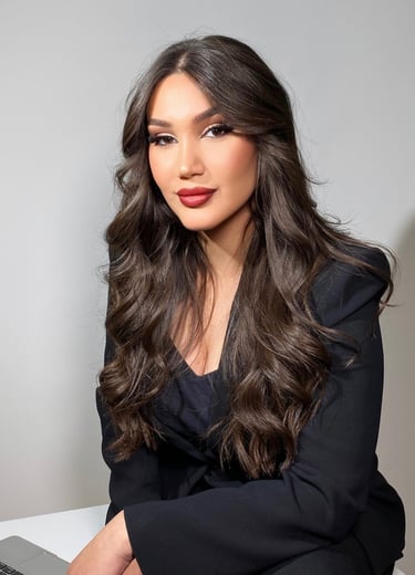 a woman with long hair and a laptop