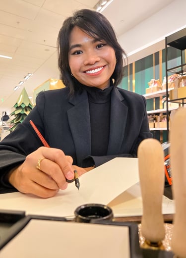 New York City Calligrapher performing live calligraphy on holiday cards with pointed pen