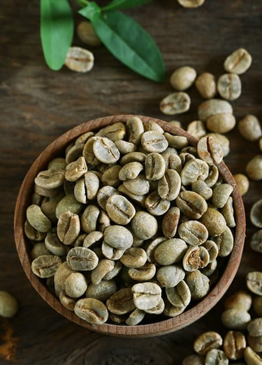 a bowl of coffee beans and a bowl of coffee beans