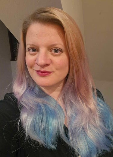 a woman with a blue and white hair and a black shirt