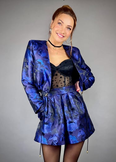 a woman in a blue dress and black stockings
