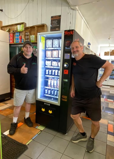 Commercial snack and drink vending machine installed at an Australian retail location.