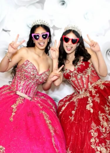 Girls in quince gowns in glam photo with heart glasses, tiara's at a Quinceañera Mirror Photo Booth.