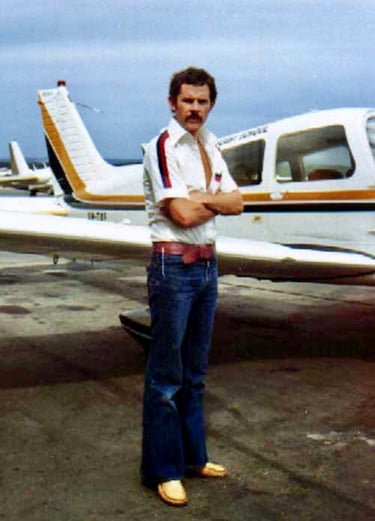 Private pilot Peter Pickering with a Piper Cherokee in the 70's