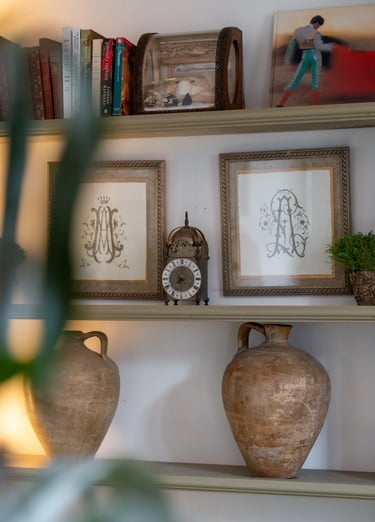 Bookshelf with pottery and decor at Finca Santa Katerina
