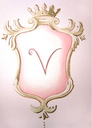 An trompe-l'oeil painted ornate pink and golden crest with a V-monogramme.