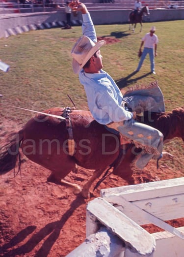 A bronc rider at the college rodeo finals in St. George, Utah, in 1967 by James Drake