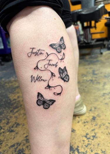a tattoo of a butterfly tattoo on a woman's leg