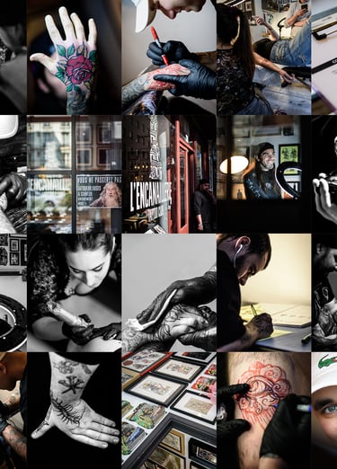 Professional tattoo artists working on detailed body art designs and sketches inside a modern tattoo studio