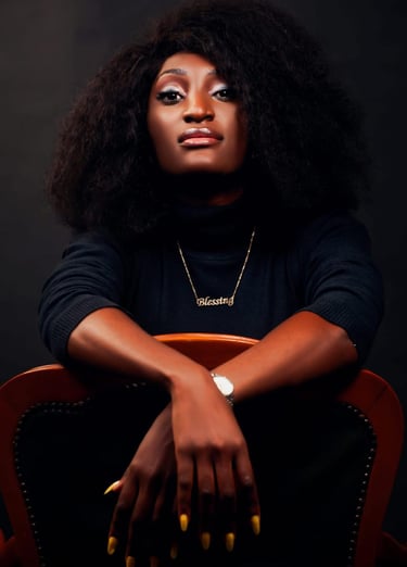 a woman with a black hair and a gold bracelet