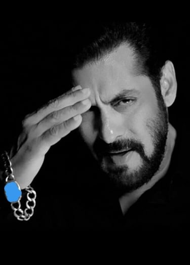 a man with a chain link bracelet and a chain link bracelet