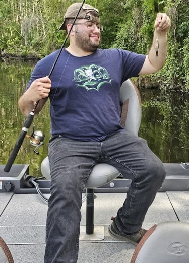 Michael holding a small bream