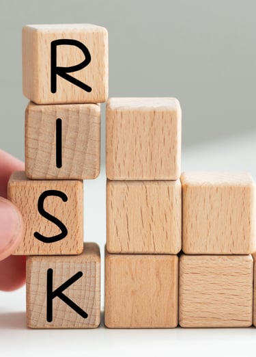 Game cube letters spell the work risk. Graphic supports the company-specific risk in valuations.