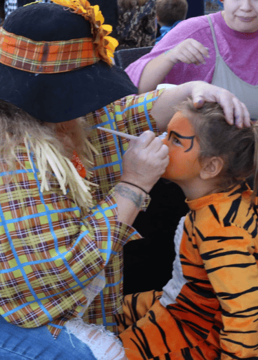 Face painting fun at a halloween event