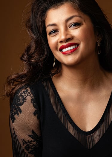 a woman with a red lipstick and a black top