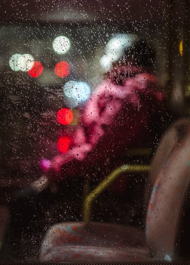 An abstract of a person seated in public transport, created by Josh K Jackson.