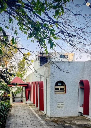 Gandhi Nilaya, a colonial-era bungalow turned heritage guest house at Nandi Hills, surrounded by lush gardens and hill views
