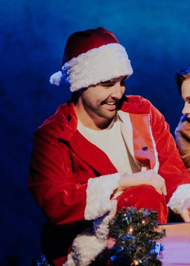 a man and woman in santa claus costume