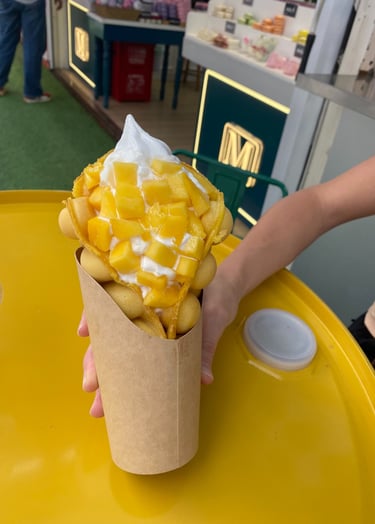 bubble waffle in shnaghai filled with mango and ice cream
