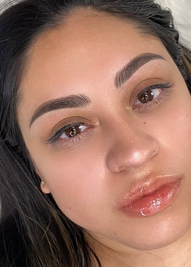 Close-up view of the natural, airy front strokes of a combo brow.