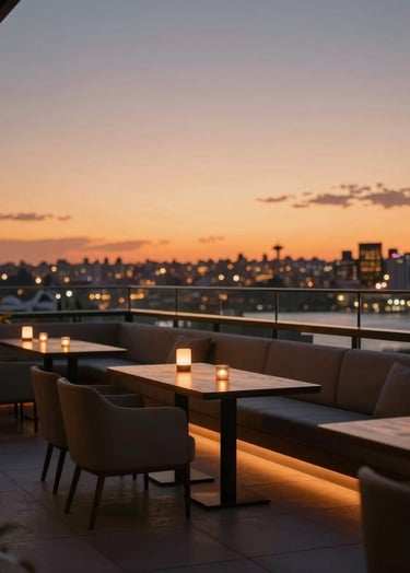 A high-end lifestyle photograph of a luxury rooftop lounge in Sydney at dusk. The composition is cinematic with soft orange ambient lighting from the sunset, featuring blurred city lights in the background. Minimalist furniture and a professional atmosphere.