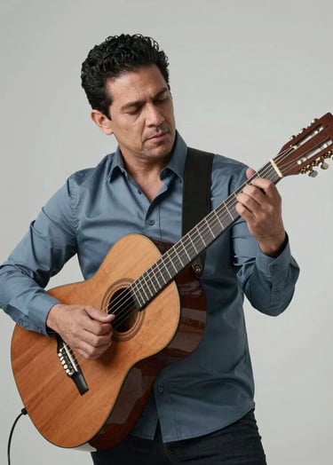 A professional portrait of Carlos Alberto Gonzalez, a male musician, playing a wooden acoustic guitar in a minimalist studio. He is dressed in a sophisticated muted slate blue shirt. The background is a misty soft white. The lighting is soft and cinematic. Setting is a modern Latin American recording studio.
