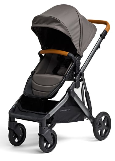 Product photography - a black stroller with brown leather straps