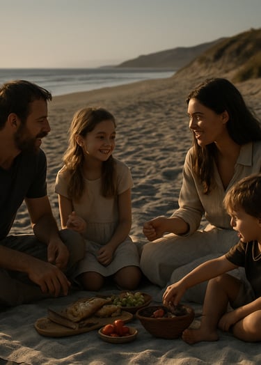 A cinematic shot of a family picnic on a North American beach. Soft sand and charcoal tones dominate the landscape, while the sun-drenched lighting emphasizes the authentic interaction and storytelling of the group.