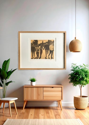 Framed family photo hanging above a wooden sideboard in a modern minimalist living room.