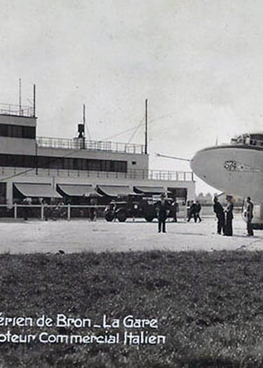 Bron Airport at Lyon, France, building and an Italian four engine propellor passenger plane