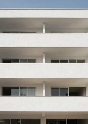 Full-width architectural photograph of a minimalist residential building in Recife, clean white lines, large openings, bright daylight, generous whitespace in composition, sophisticated and contemporary.