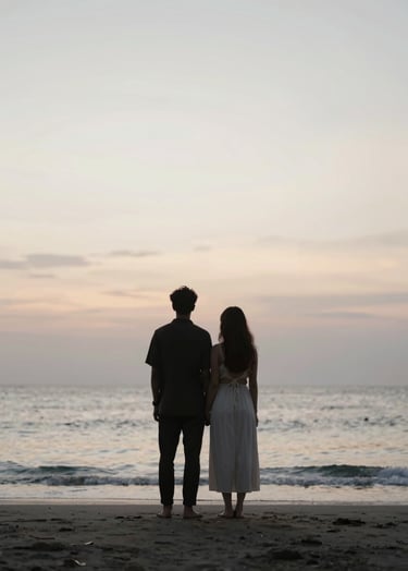 A minimalist portrait of a couple on a secluded Bali beach at sunset, silhouetted against a soft #F8F5EF sky. The lighting is ethereal and natural, embodying elegant storytelling.