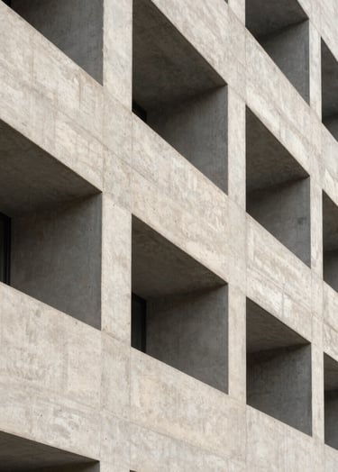 A high-end architectural photograph of a brutalist concrete facade, sharp lines, morning light, soft gray and off-white palette, Global / Contemporary Art.