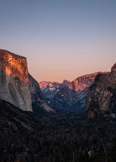A breathtaking landscape photograph of a North American / US national park during the golden hour. The sky features soft dusty rose and muted steel blue hues, highlighting the authentic beauty of nature.