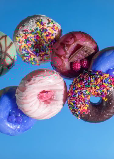 a variety of soap donuts and soap donuts on a blue background
