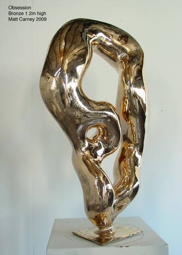 a highly polished reflective abstract bronze sculpture 