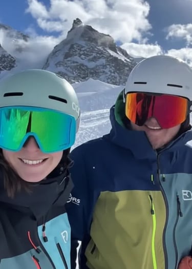 Happy skiers wearing helmets and goggles enjoying the sunny slopes and après-ski vibes at Zermatt Sk