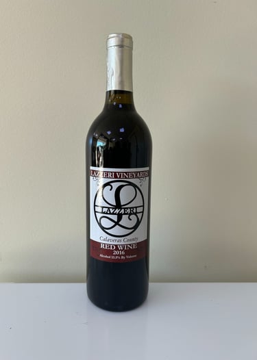 An unopened bottle of wine labeled 2016 Red Blend