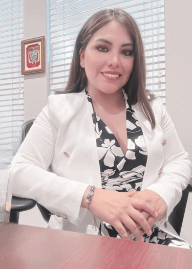 a woman in a white jacket and black dress