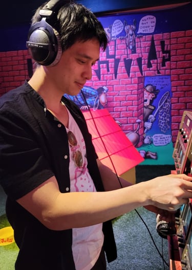 a man in headphones and headphones playing video games