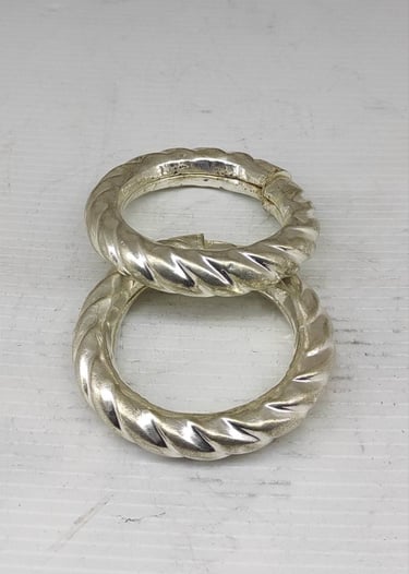 "Bold handcrafted bangle pair with curved tribal design–artificial metal finish-for foreign trade"