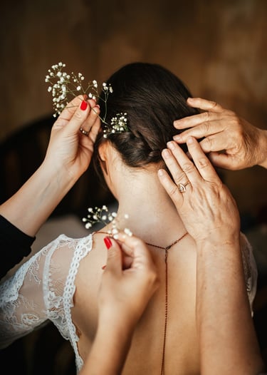 Hair model in bridal updo with veil.
