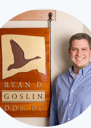 picture of Dr. Goslin next to his sign