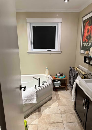 a bathroom with a tub in the corner