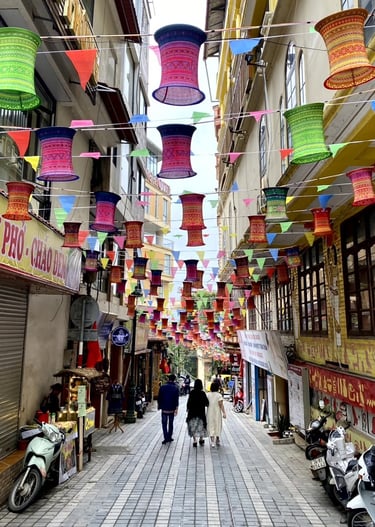 a couple of people walking down a street