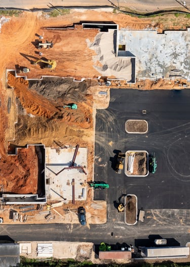 a building under construction with a lot of construction materials