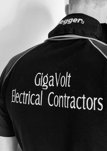A shirt with GigaVolt Electrical Contractors embroidered on the back