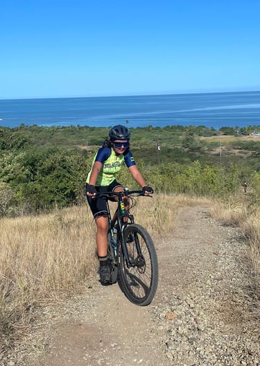 a person riding a bike on a dirt road