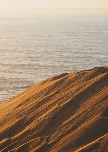 moroccan sanddunes with ocean background