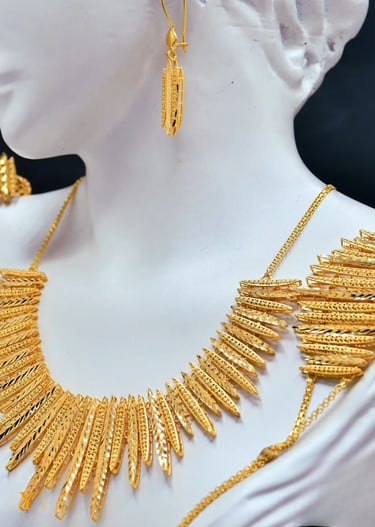 a gold necklace with a gold necklace and a gold necklace
